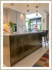 kitchen island with brass panels and doors london