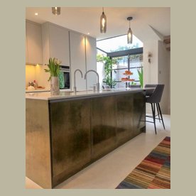 kitchen island with brass panels and doors london