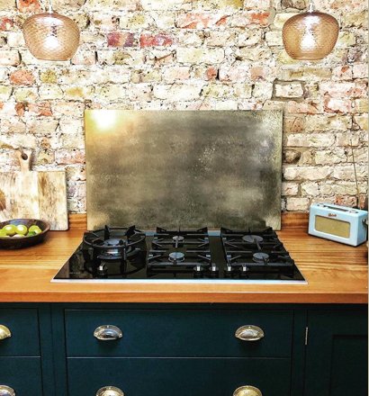 small brass splashback mottled finish kitchen