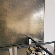 aged brass hob splashback