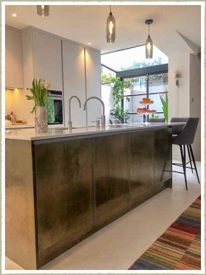 kitchen island with brass panels and doors london
