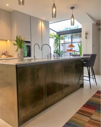 kitchen island with brass panels and doors london