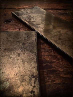 brass samples on wood