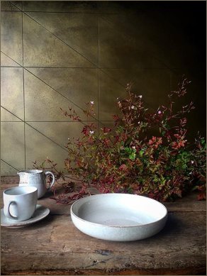 brass tiles triangle splashback